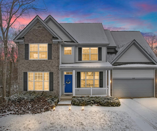 view of front of house featuring a garage and covered porch