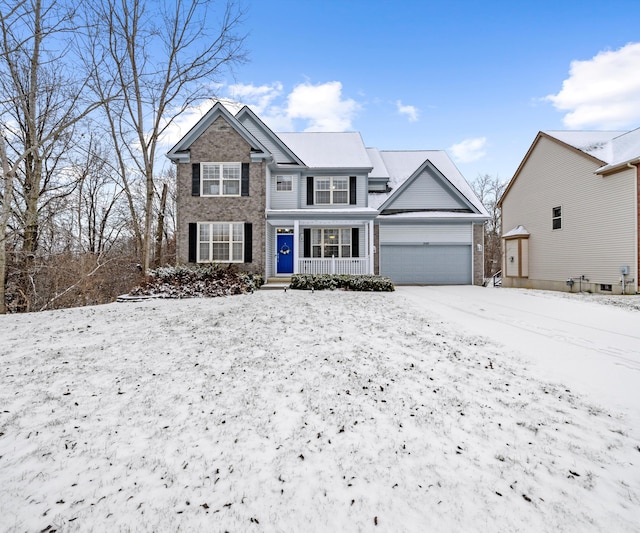 view of front of property featuring a garage and a porch