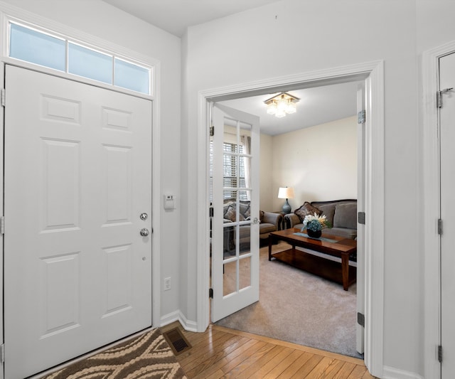 foyer entrance with light wood-type flooring