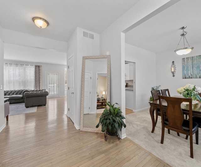 dining area with light hardwood / wood-style flooring