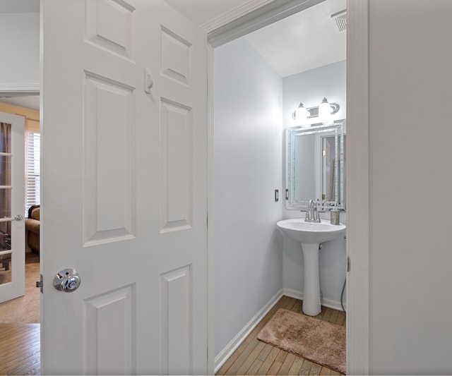 bathroom with wood-type flooring