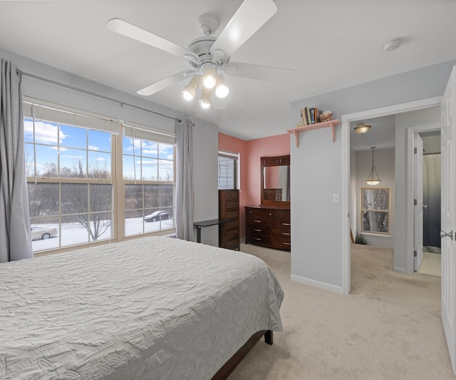 bedroom featuring light colored carpet and ceiling fan