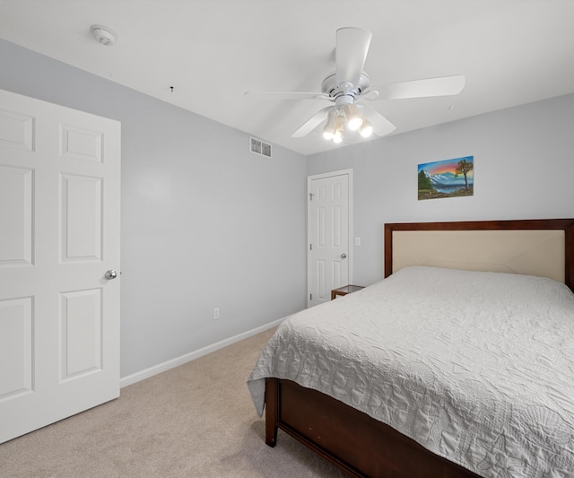 carpeted bedroom with ceiling fan