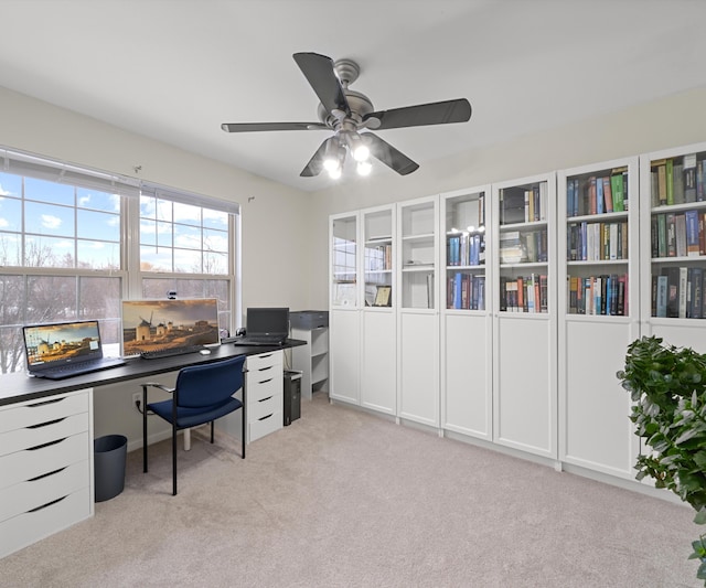 office with ceiling fan and light carpet