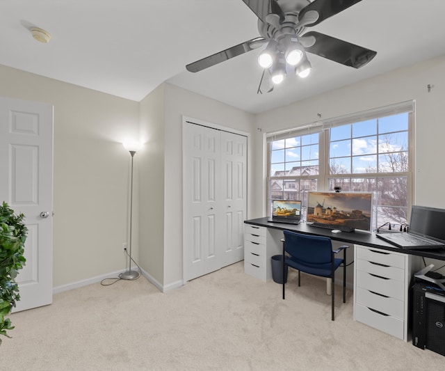 office featuring light carpet and ceiling fan