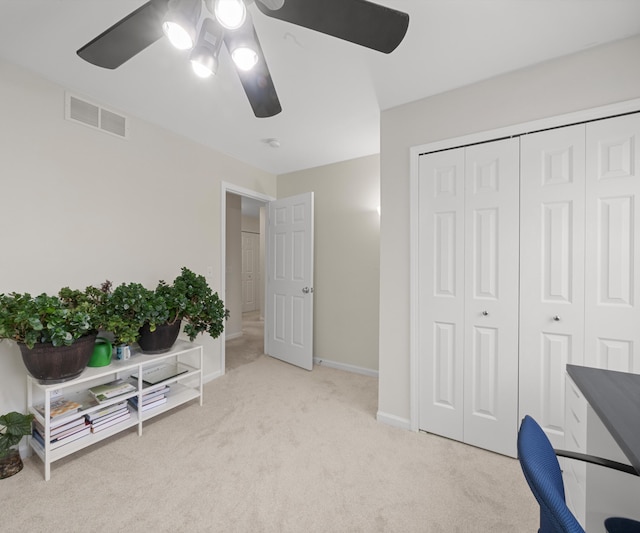 home office with light colored carpet and ceiling fan