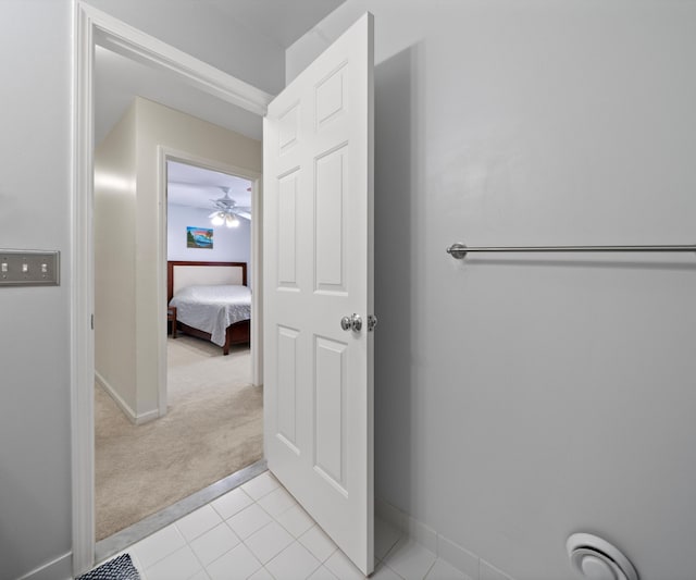 bathroom with tile patterned floors and ceiling fan