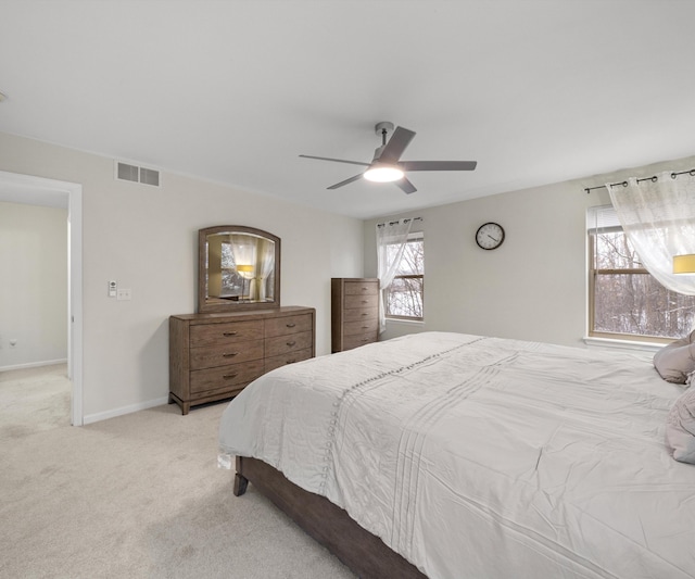 bedroom featuring ceiling fan and light colored carpet