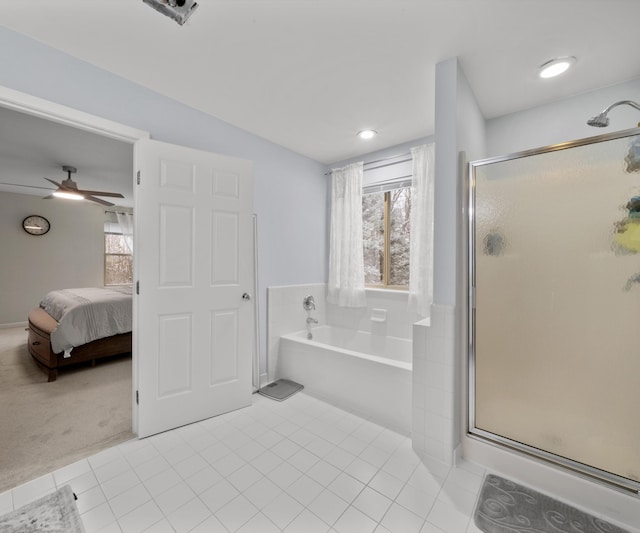 bathroom with tile patterned floors, a healthy amount of sunlight, and separate shower and tub