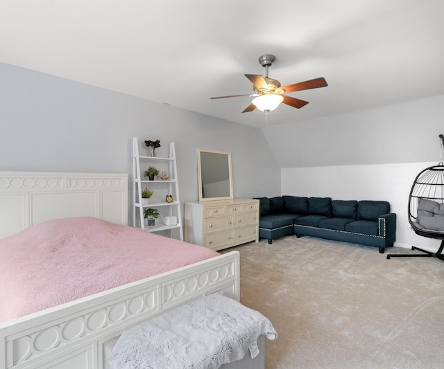 bedroom with lofted ceiling, light colored carpet, and ceiling fan