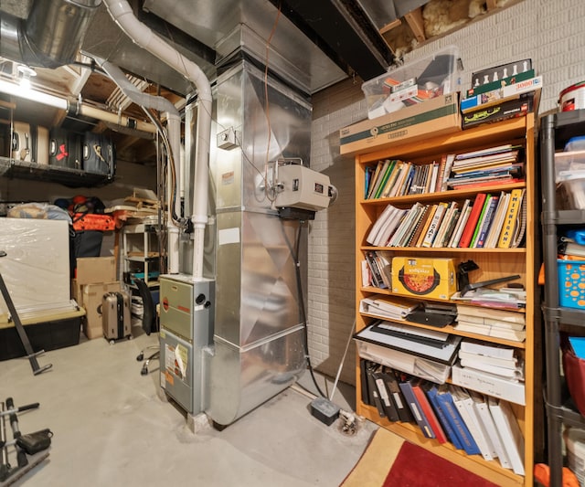 utility room with heating unit