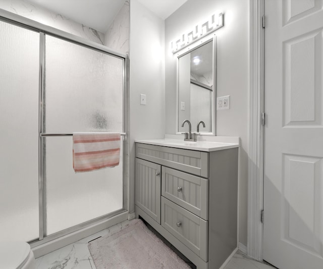 bathroom with vanity and walk in shower