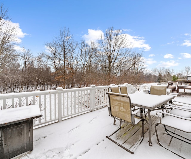 view of snow covered deck