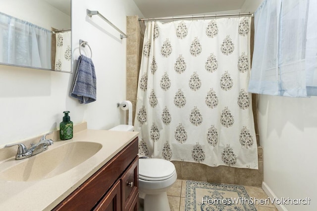 bathroom featuring walk in shower, tile patterned floors, toilet, and vanity