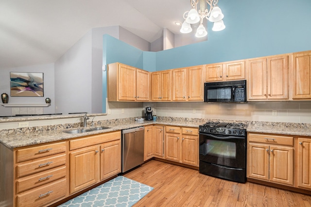 kitchen with sink, tasteful backsplash, black appliances, light hardwood / wood-style floors, and light stone countertops