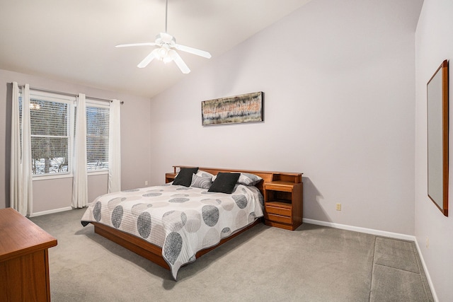 bedroom with lofted ceiling, light colored carpet, and ceiling fan