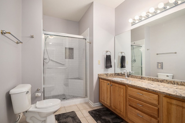 bathroom with an enclosed shower, vanity, tile patterned flooring, and toilet