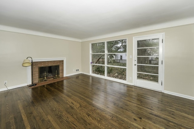 unfurnished living room with dark hardwood / wood-style floors and a fireplace