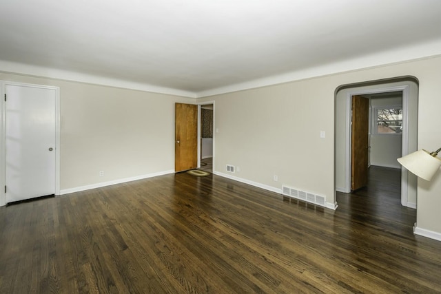 spare room with dark hardwood / wood-style flooring