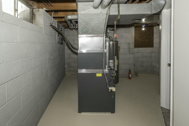 utility room with water heater and heating unit