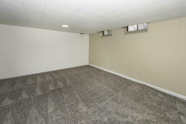 basement with dark colored carpet