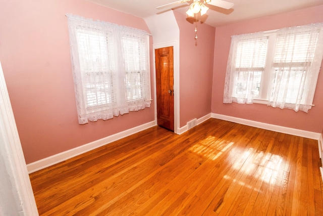 unfurnished bedroom with hardwood / wood-style floors and ceiling fan