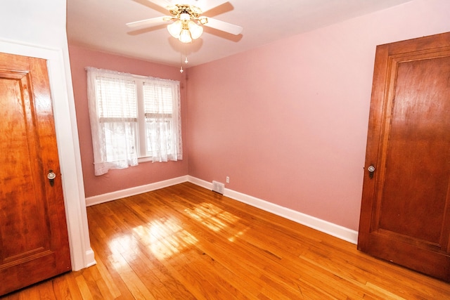 unfurnished bedroom featuring ceiling fan and light wood-type flooring