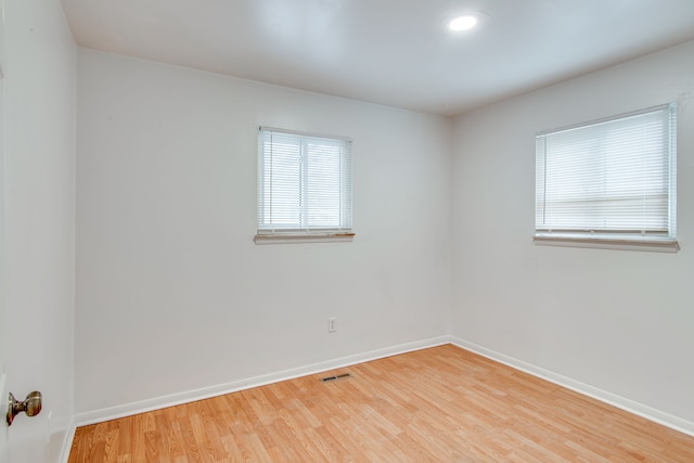 unfurnished room featuring wood-type flooring