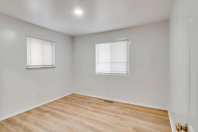 spare room with light wood-type flooring