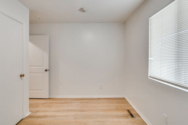 unfurnished room featuring light hardwood / wood-style flooring