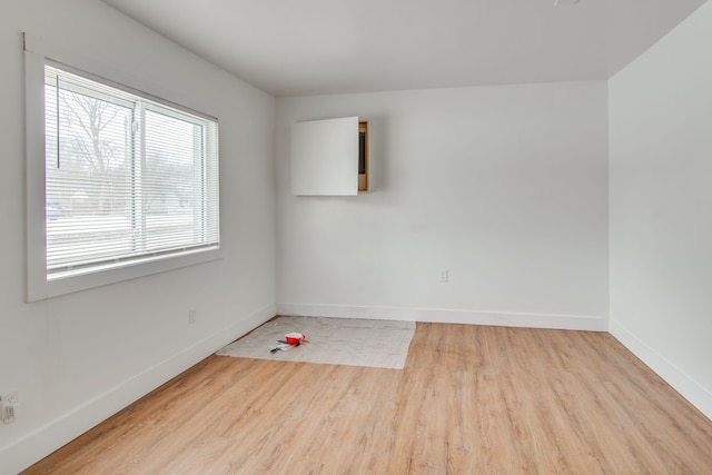 spare room featuring light wood-type flooring