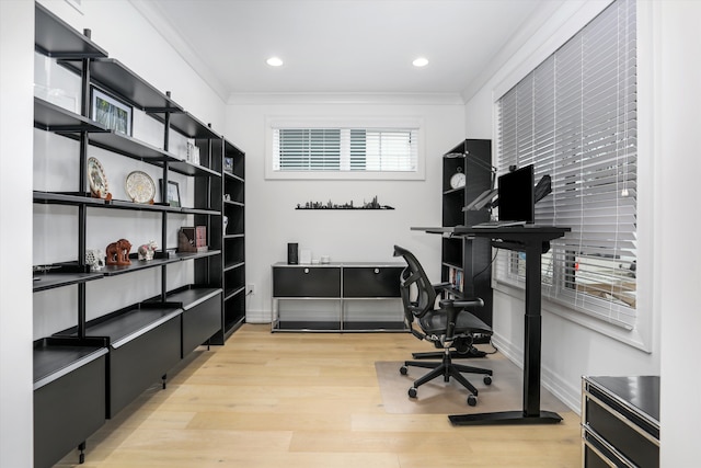 office space with crown molding and light hardwood / wood-style floors