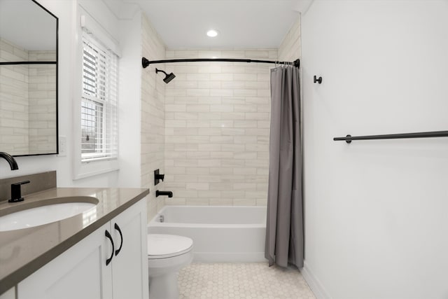 full bathroom with shower / bath combination with curtain, tile patterned floors, vanity, and toilet