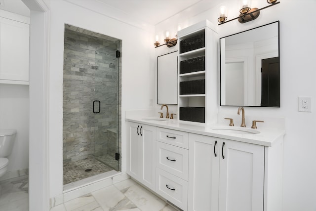 bathroom featuring vanity, a shower with door, and toilet