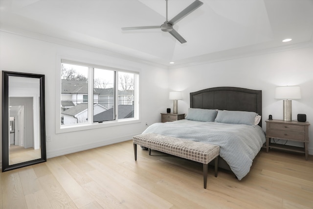 bedroom featuring crown molding, ceiling fan, lofted ceiling, and light hardwood / wood-style flooring