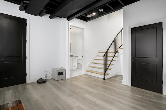 basement featuring light hardwood / wood-style floors