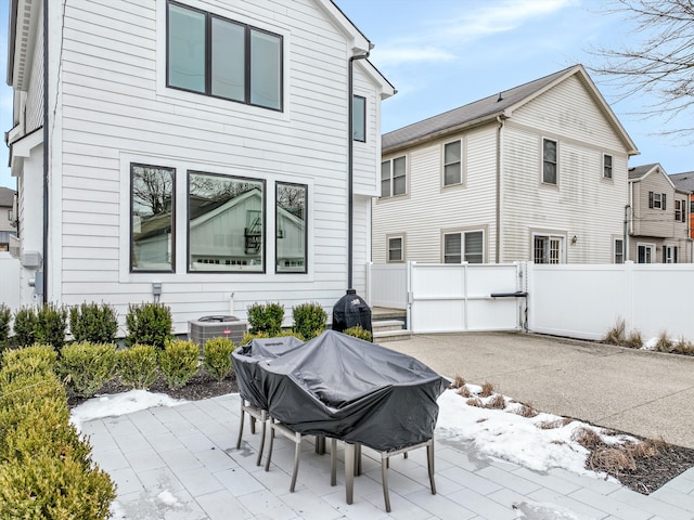 back of property with a patio