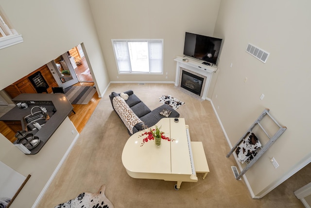 living room featuring a high ceiling