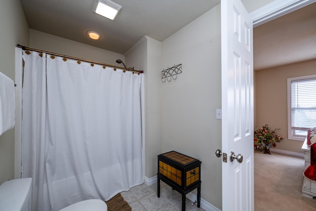 bathroom with tile patterned floors