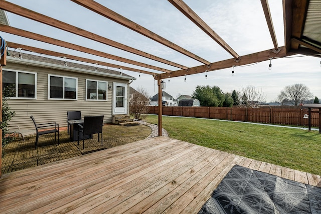 deck featuring a lawn and a pergola