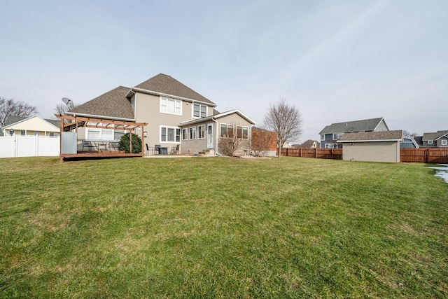 back of house featuring a yard, a pergola, and a deck