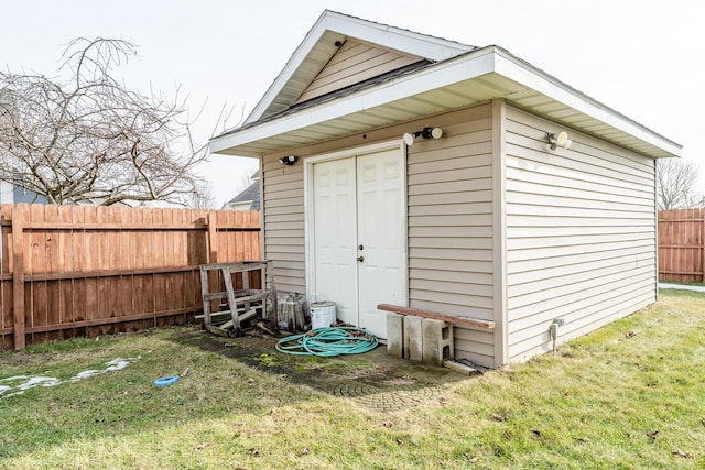 view of outdoor structure with a lawn