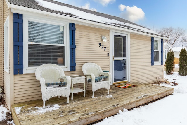 view of snow covered deck