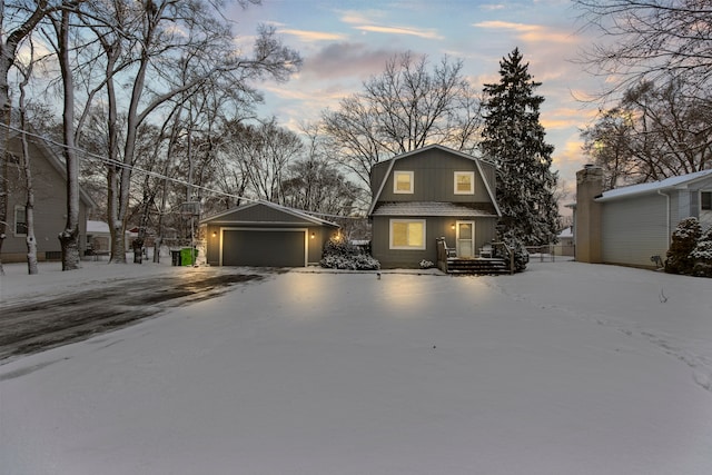 view of front of house featuring a garage and an outdoor structure