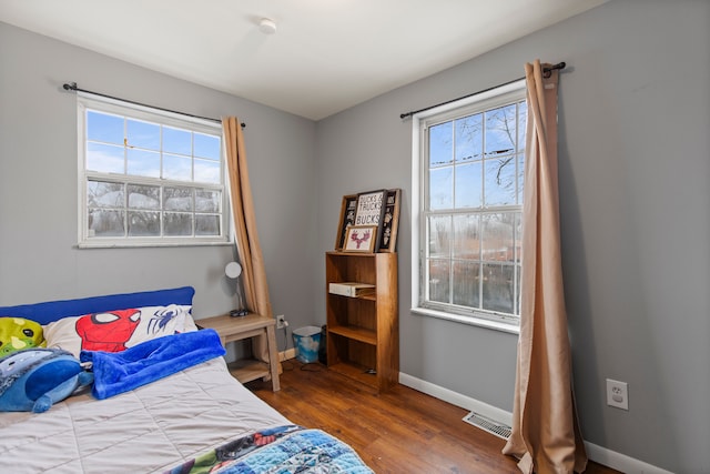 bedroom featuring dark hardwood / wood-style flooring