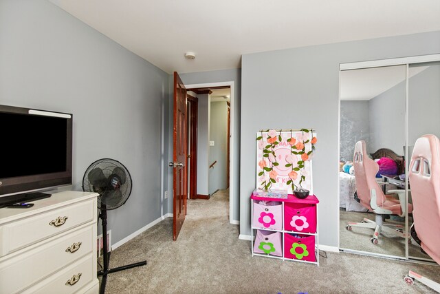 carpeted bedroom featuring a closet