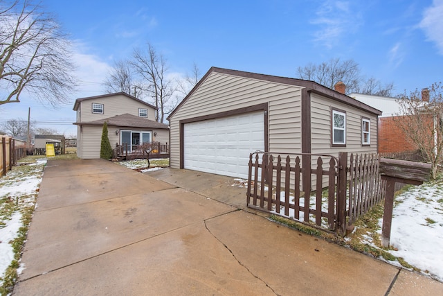 exterior space featuring a garage and an outdoor structure