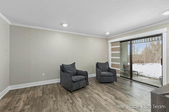 living area featuring ornamental molding and hardwood / wood-style floors