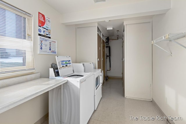 laundry area with washing machine and clothes dryer