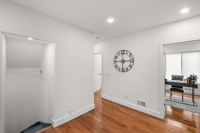 unfurnished room featuring hardwood / wood-style flooring